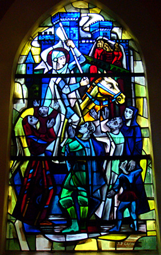 Stained Glass Window of Joan of Arc on horseback with banner